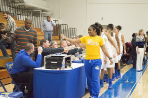 Girls team thanking the officials and volunteer staff after the game on Feb. 26. LAUREN MARRETT | THE HARBINGER