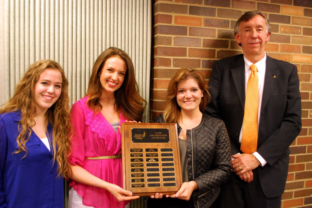From ICC's American Institute Of Architecture Students (AIAS) chapter, left to right, Treasurer Lauren Rockwell, President Rebecca Palmer, Vice President Kelsey Kauffman and faculty advisor Al Rusch with the Club/Organization of the Year plaque that now bares their name. REID HARMAN | THE HARBINGER