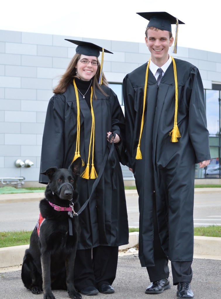 Siblings Marissa and Christian Brown and her dog Freedom think about their futures after all attended today's commencement. REID HARMAN|HARBINGER