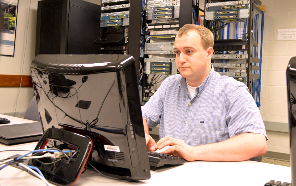 Nathaniel Riehl has been a student employee in ICC's technology services department while also studying computer programming here. Riehl won first in the nation in computer programming at SkillsUSA 2014. REID HARMAN | THE HARBINGER