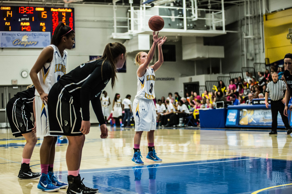 April Gebke shoots a free throw in a February game against Parkland. MARK NYCZ | THE HARBINGER