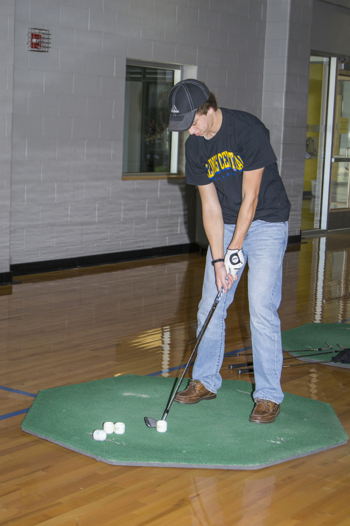 Mitch McCafferty of the ICC golf team practices in the CougarPlex leading up to the beginning of their season. TERESA WILLIAMS | THE HARBINGER