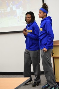 Photo by Christian Harr. Sophomores Jemia Carpenter and Destiny Ramsey speaking in a room full of their fans.